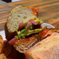 Braised Pork Sandwich · Hatch chile, pickled onion, Jack, avocado.