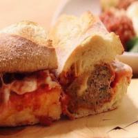 Braised Meatball Sandwich · Provolone, tomato sauce.