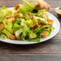 Caesar Salad · Crisp Romaine, garlic croutons, Parmesan cheese and Caesar dressing.