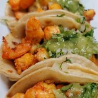Shrimp Tacos · 3 pieces. Tacos made with a choice of soft corn tortilla with onions and cilantro on top.