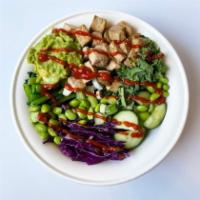 Buddha Rice Bowl · Tofu on quinoa, with avocado, kale, choy sum, red cabbage, edamame, cucumbers, scallions, ci...