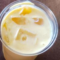 Mango Lassi · Ripe mangos blended with yogurt and milk. Made fresh daily. 