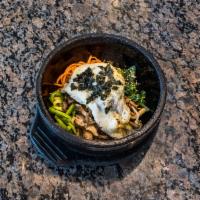 53. Dol-sot bibim bap · Hot stone bowl with rice, vegetables, beef and a fried egg. Comes already mixed and slightly...