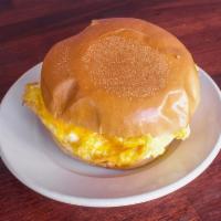 Breakfast Sandwich · 2 eggs, cheddar, tomato, scallions, and remoulade on a rosemary roll. Choice of meat bacon, ...