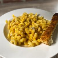 Manhattan Mac and Cheese · A large portion of cavatappi pasta mixed with creamy, melted cheddar cheese. Add protein for...