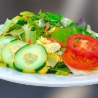 V-House Garden Salad  · Combine lettuce, tomatoes, olive, and cucumbers and lemon on side . Drizzle with salad dress...