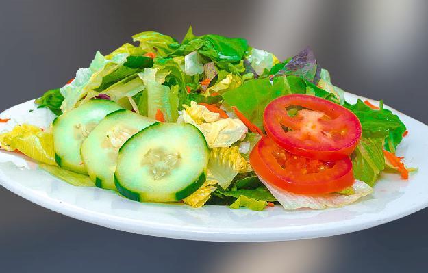 V-House Garden Salad  · Combine lettuce, tomatoes, olive, and cucumbers and lemon on side . Drizzle with salad dressing.