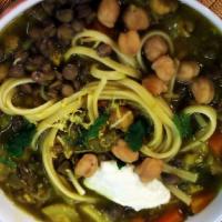 V-Noodles Soup آش رشته  · Traditional Persian soup with herbs, spinach, cilantro, turnips, oats lentils, noodles, bean...