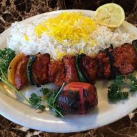 Shish Kabab شیش کباب · Succulent chunks of filet mignon marinated and grilled with tomato onion served with Basmati...