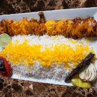 Cornish Chicken Kabab جوجه با استخوان · Skewered, marinated and grilled cornish game hen and grilled tomato and onion served with ba...