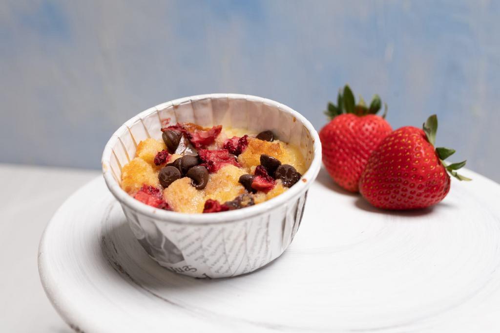 Strawberry Bread Pudding · Our delicious bread pudding in a new summer version. Fresh strawberries combined with chocolate chips in this full of flavor bread pudding.