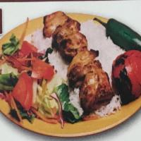 Chicken Kabob Plate · Served with rice, grilled tomato, grilled jalapeño, hummus, lettuce salad, and pita bread.