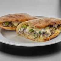 Philly Cheese Steak · Green peppers, onion, mushroom and mozzarella. Add bread for an additional charge.