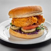 Chicken Burger · Tender chicken breast, red cabbage, pickles, tomatoes, thousand island dressing.