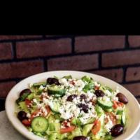 Greek Salad · Romaine lettuce, feta cheese, cucumber, bell peppers, Kalamata olives and tomato.