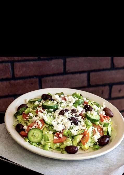 Greek Salad · Romaine lettuce, feta cheese, cucumber, bell peppers, Kalamata olives and tomato.