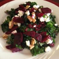 Kale Salad · Hand-marinated kale with a lemon pepper olive oil dressing, sun-dried cranberries, walnuts, ...