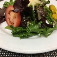 Utopia Salad · Mixed greens, tomato and pepperoncini with Dijon vinaigrette and shredded Parmesan cheese. V...