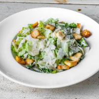 Caesar Salad · Romaine lettuce, croutons, Parmesan cheese, and Caesar dressing.