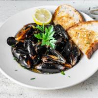 Sauteed Mussels · Pei mussels, white wine, and baguette.
