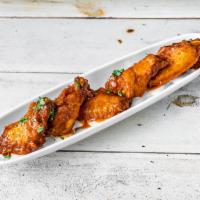 Chicken Wings · Blue cheese dressing and spicy homemade sauce.