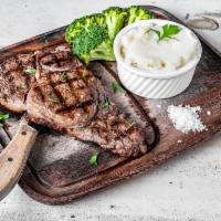 Rib Eye Steak · 16 oz. Mashed potatoes and broccoli.