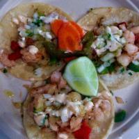 Taco de Camaron · Shrimp taco. Camaron a la plancha, cilantro, cebolla, and salsa. Grilled shrimp, cilantro, o...