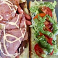 Panini Chilango · Panini sandwich con Milanesa, salchicha, jamón, frijoles, mayonesa de chipotle,queso,guacamo...