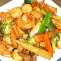 H7. Four Seasons Delicacy  · Squid, chicken, shrimp, scallop, crab meat with fresh vegetable in brown sauce.	