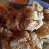 A5. Calamari Ring · Deep fried lightly battered calamari rings served with house special sauce.