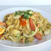 R3. Pineapple Fried Rice · Yellow rice stir fried with choice of meat, egg, raisin, onions, pineapple, topped with cash...