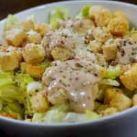 Caesar Salad · Traditional Romana style salad, parmesan, croutons, and homemade dressing. Portions serve tw...