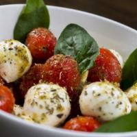 Caprese Salad  · Mozzarella cheese, tomatoes, basil, olive oil & balsamic vinegar. Portions serve two (2).