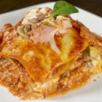 Traditional Lasagna  · Ground beef stuffed, bay leaf, basil, celery, carrot, white wine, mozzarella, parmesan chees...