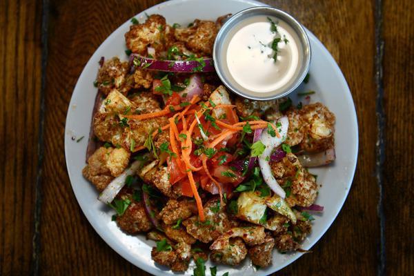 Fried Cauliflower · Cauliflower florets fried, then served with pine nuts and lemon juice.