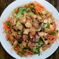 Fattoush Salad · Romaine hearts, tomatoes, cucumbers, carrots, radishes, sliced onion, pita chips, spices and...