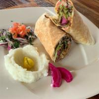 Falafel Sandwich · Falafel, lettuce, tomatoes, onions, parsley, hummus, and baba ghanoush. (option to add a side)