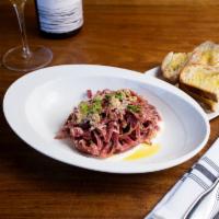 Tagliolini Rossi alla Quaglia · Home made red beet tagliolini served with a quail ragu on a bed of a taleggio fondue.