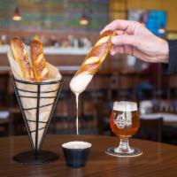 Pretzels and Beer Cheese · Soft, warm Bavarian pretzel sticks brushed with butter and sprinkled with sea salt, served w...