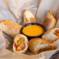 Southwest Eggrolls · Crispy egg rolls loaded with chicken, cheese, black beans, corn, and jalapenos. Served with ...