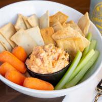 Pimento Cheese · Spicy jalapeno pimento cheese served with pita chips, carrots, and celery.