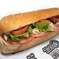 Tubby's Famous Sub Combo · Cotto salami, hard salami, ham, cheese, onions, lettuce, tomatoes and Tubby's famous dressin...