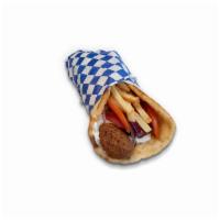 Falafel Sandwich · Wrapped in pita bread, with tzatziki sauce, tomatoes, onions and french fries.