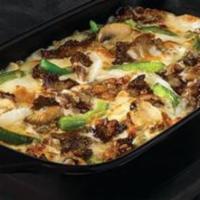 The Philly Pizza Bowl · Crustless pizza baked in a bowl. Melty white cheese sauce, tender shaved steak, marinated mu...