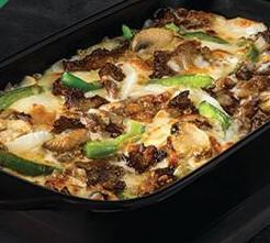 The Philly Pizza Bowl · Crustless pizza baked in a bowl. Melty white cheese sauce, tender shaved steak, marinated mushrooms, freshly sliced green peppers and onions and our three fresh signature cheeses 