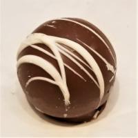 Rum Truffle · creamy rum flavored chocolate center in a rich milk chocolate shell (non-alcoholic)