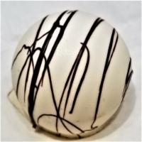 Champagne Truffle · creamy champagne flavored dark chocolate center in a shell of sweet white confection
