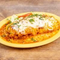 Breakfast Burrito · Our traditional breakfast burrito comes with beans, rice, cheese, carne azada and scrambled ...