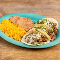 Tacos Plate Combo · 3 Pieces. 3 soft tacos with rice and  beans onions and cilantro.