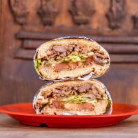 Torta · Mexican sandwich. Mexican sandwich comes with spread beans, lettuce, tomato, avocado, mayo, ...